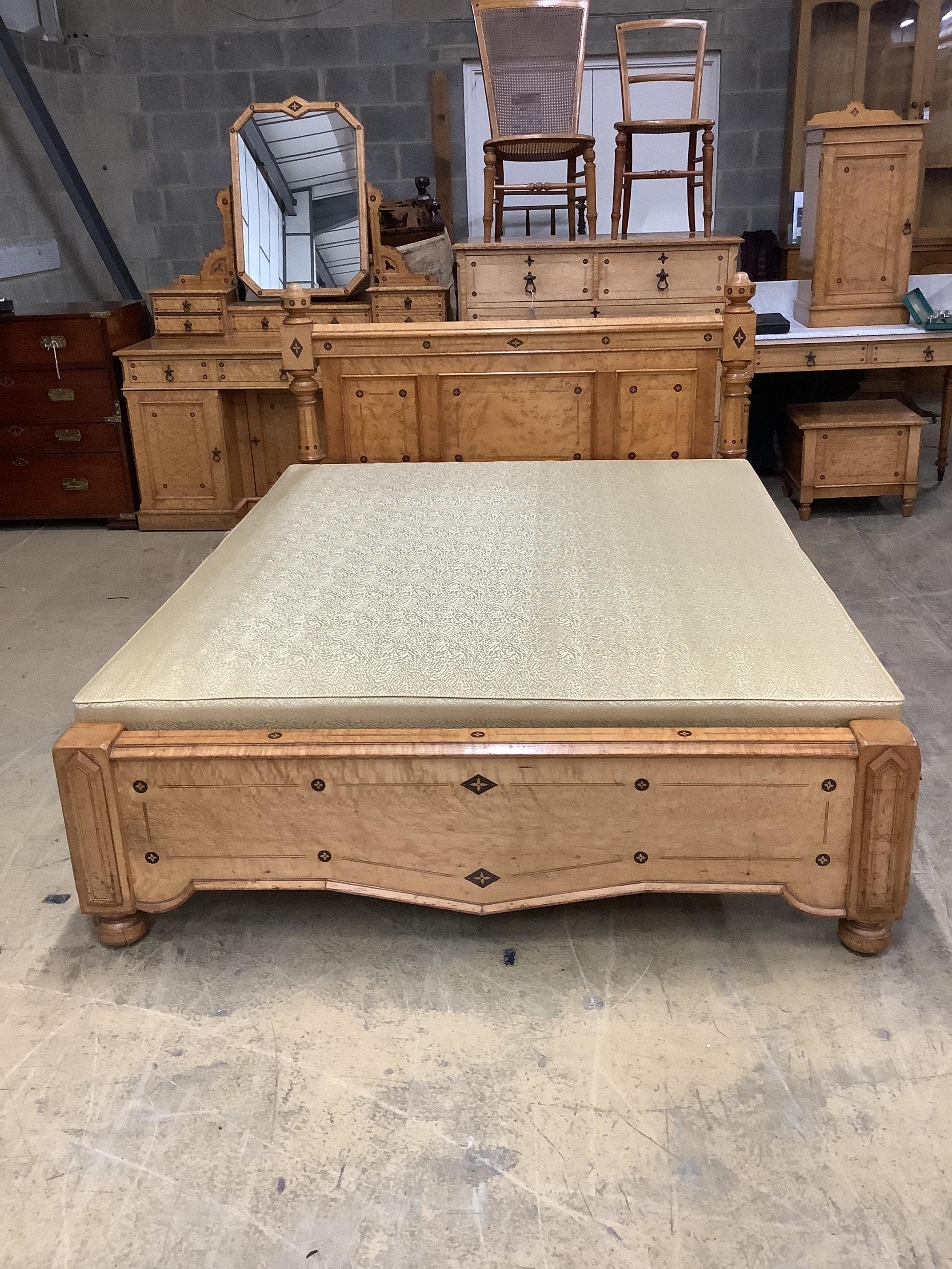 A late Victorian Gothic revival ebony inlaid, bird's eye maple bedroom suite, manner of Charles Bevan, comprising 5ft bed frame, kneehole dressing table, chest of drawers, marble top washstand, bedside cabinet, commode a